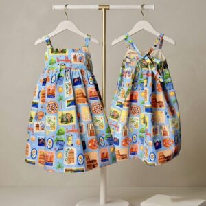 Hello World Sienna Sun Dress - organic cotton sundress with hand-painted travel stamp print