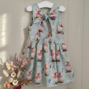 Rabbit & Hare Woodland Fairy dress in Mist — organic cotton dress with hand-painted fairies dancing on tree stumps, with a tie-back detail